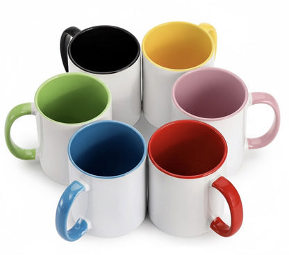 Set of six colorful mugs with different colored interiors on a white background