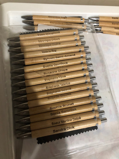 Set of branded pens with visible branding on a white background